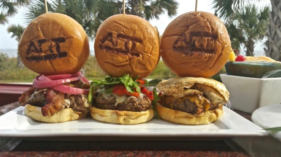 A delicious looking hamburger with a grilled bun