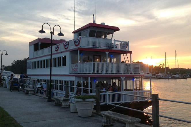 A picture of the Barefoot Princess River Boat on the waterway.